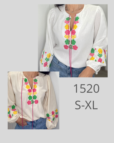 Blusa blanca con bordados coloridos en el cuello y mangas, disponible en tallas S-XL.